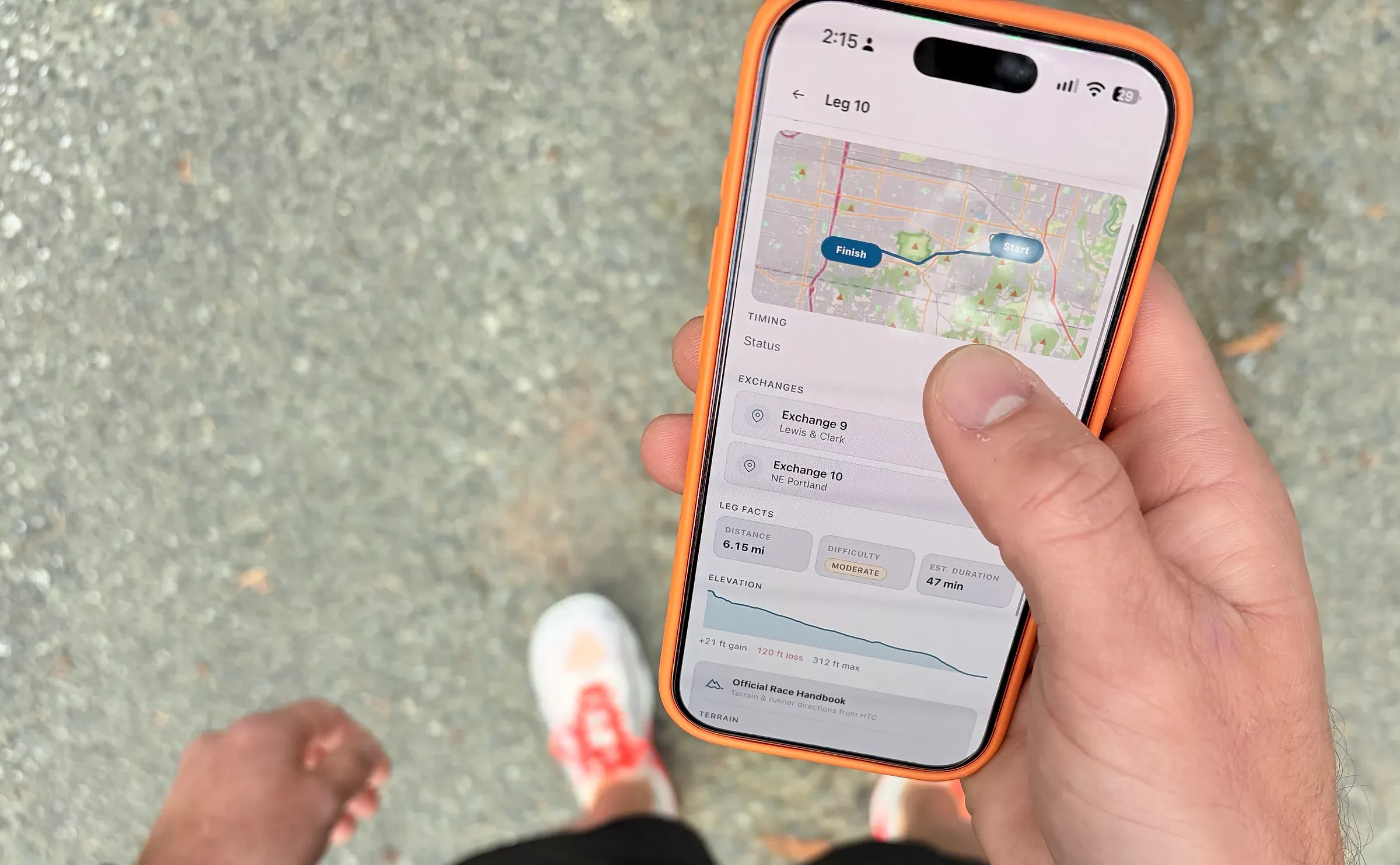 A runner holds an iPhone showing the tracker's Leg 10 view: a route map, exchanges, distance, difficulty, and elevation.